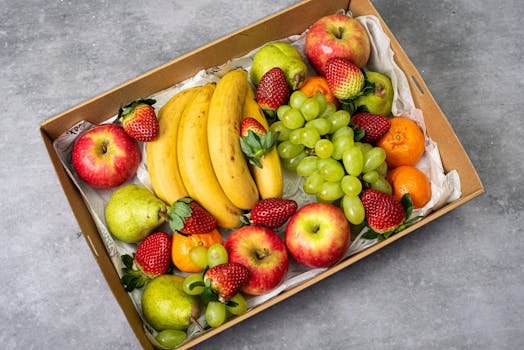 A delicious assortment of fresh fruits including apples, bananas, strawberries, and grapes.