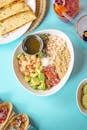 Colorful Mexican-inspired bowl with beans, avocado, and quinoa.